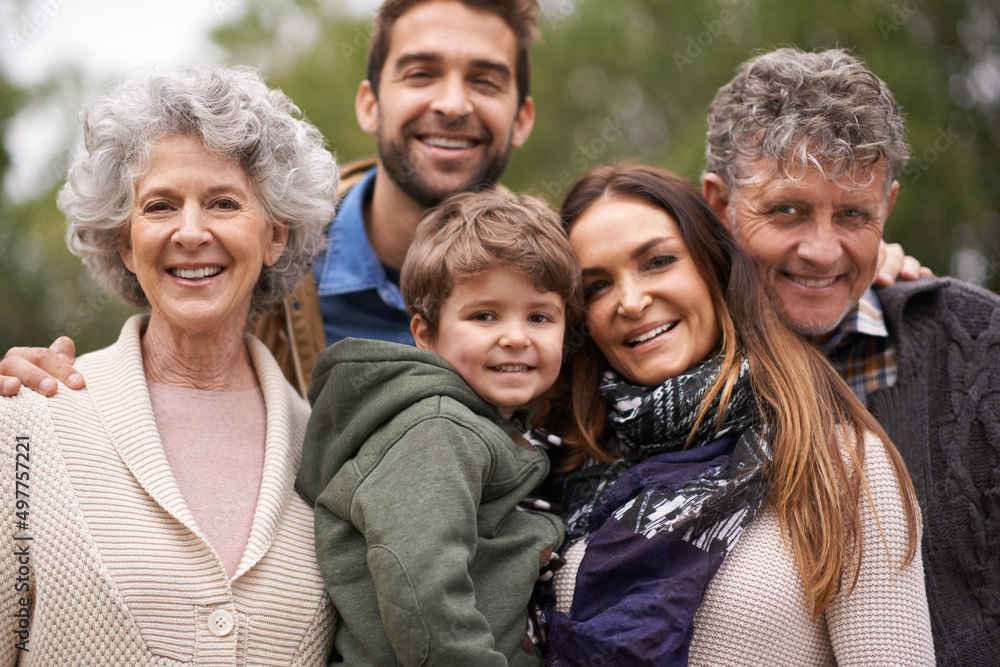 One big happy family. Portrait of a happy multi-generation family standing outdoors.