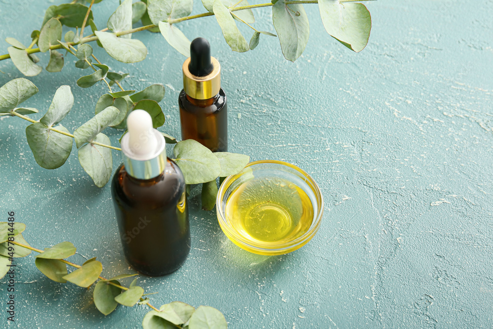 Natural eucalyptus essential oil on color background