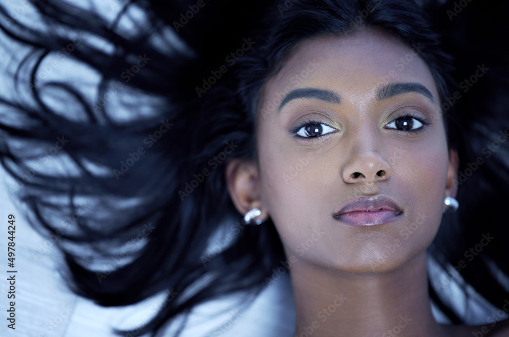 Lustrous locks are all Ive ever wanted. Shot of a young woman with gorgeous hair in a studio.