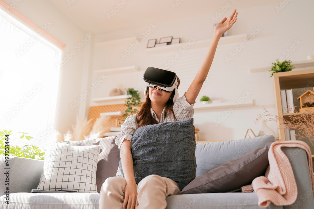 happiness exited asian female teen hand wave along with her virtual concert performance via virtual 