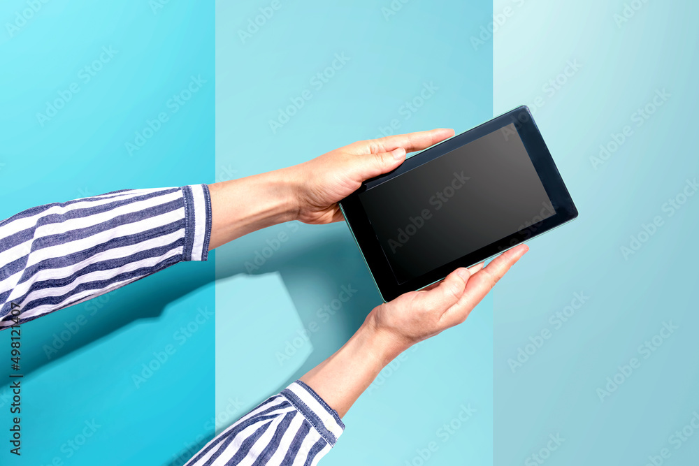 Woman using a tablet computer from above