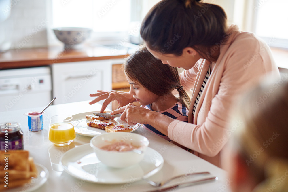 Having fun at the breakfast table. Shot of a family having breakfast together.