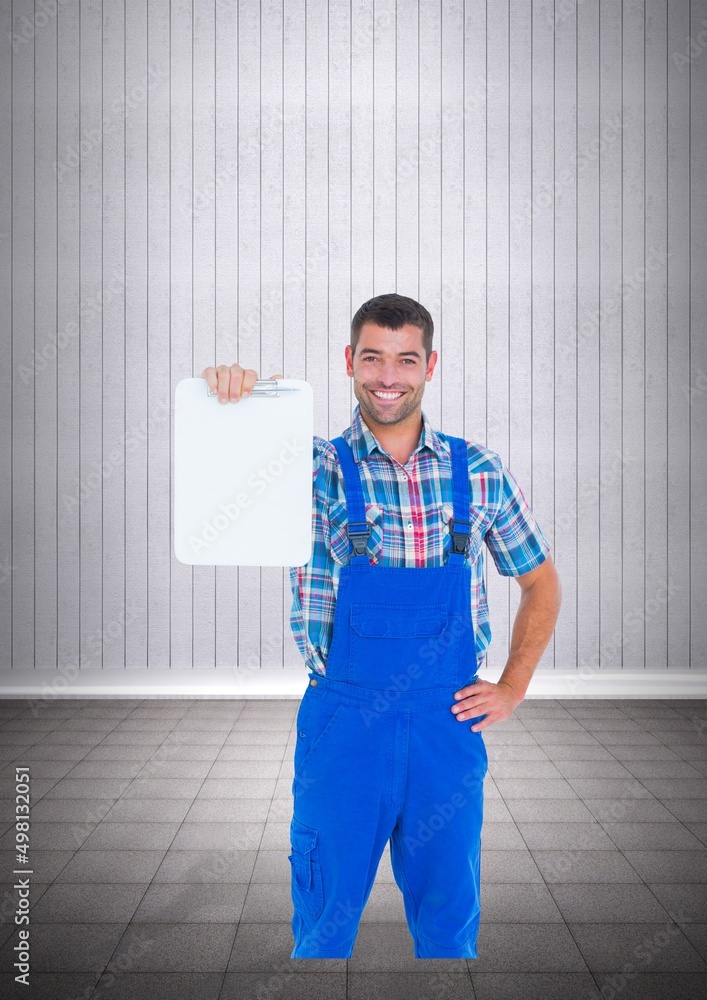 Portrait of caucasian male worker holding a clipboard against copy space on striped grey background