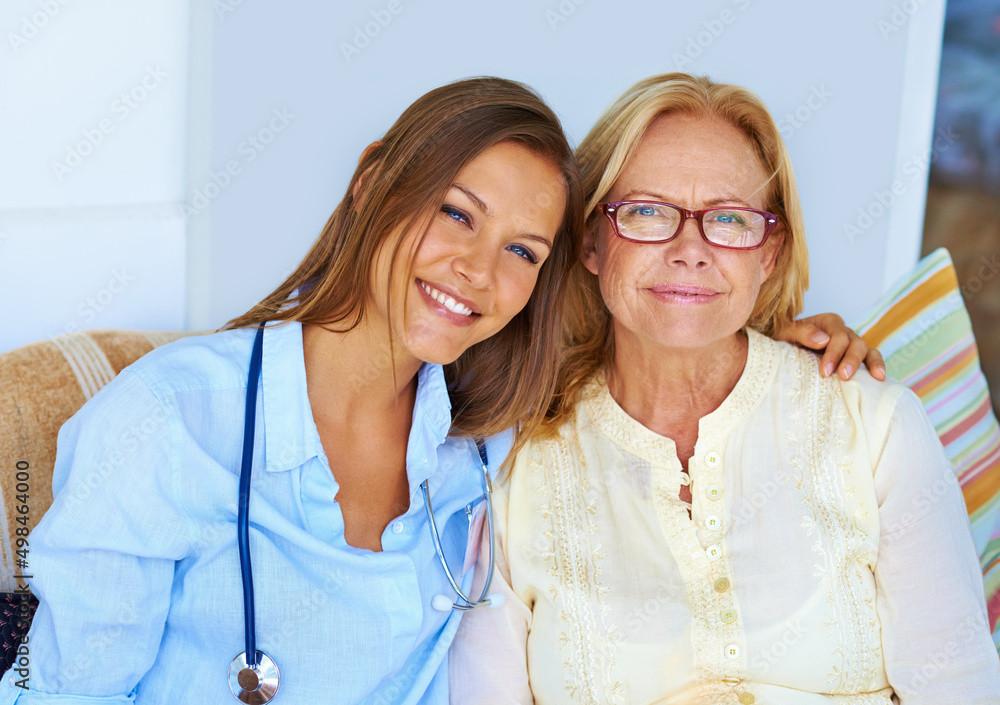 They have a bond thats unbreakable. Shot of a medical professional sitting lovingly next to her pati