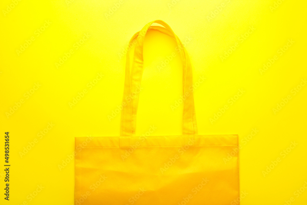 Fabric tote bag on yellow background