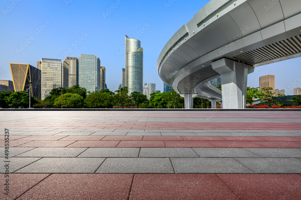 Empty square floor and city skyline with modern commercial buildings in Hangzhou, China.