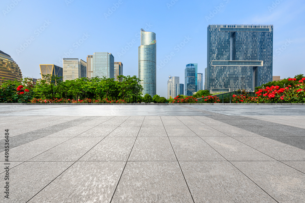 Empty square floor and city skyline with modern commercial buildings in Hangzhou, China.