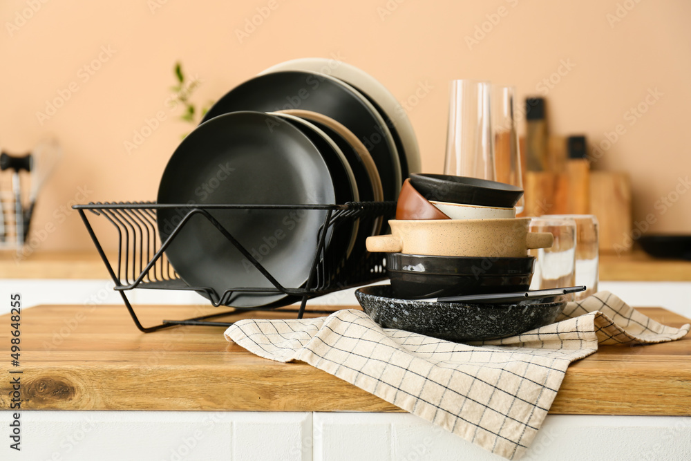 Set of clean tableware in kitchen