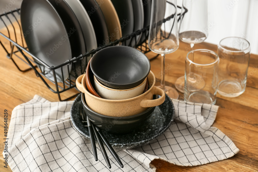 Set of clean tableware in kitchen