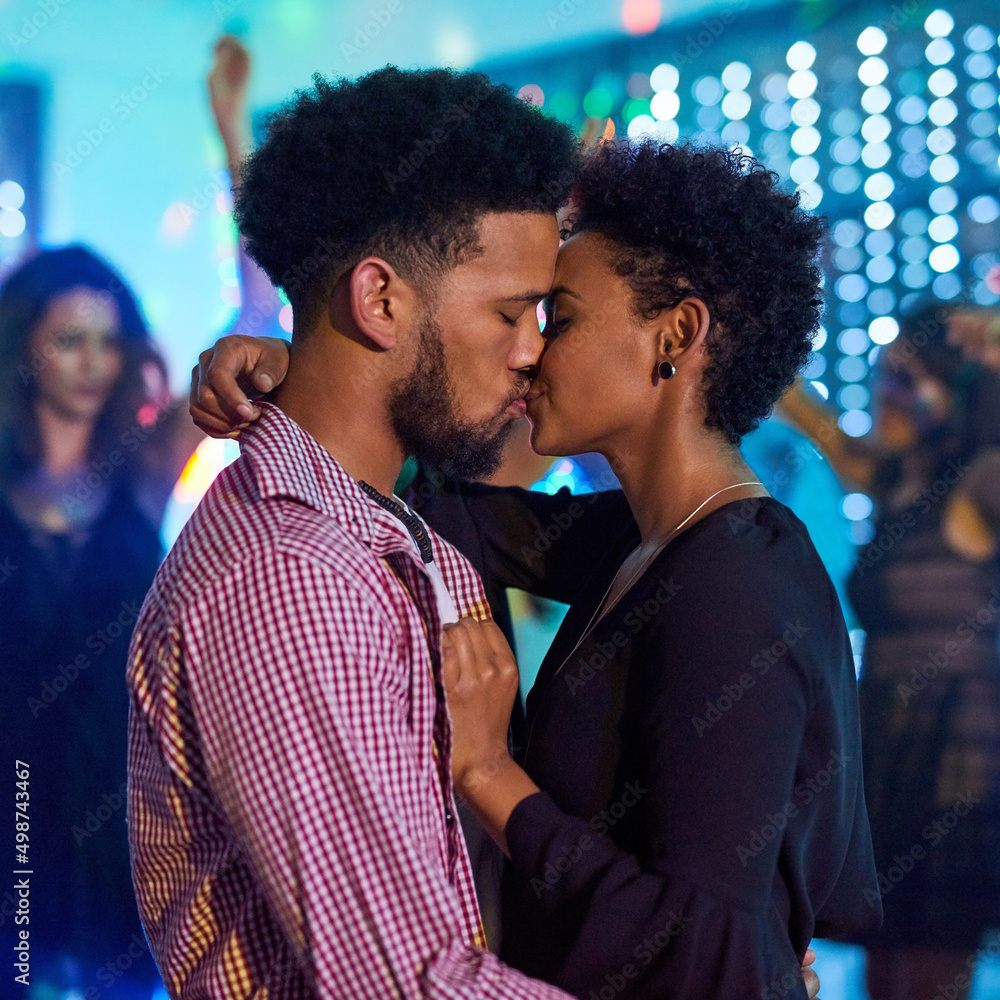 Feeling the love in the club. Cropped shot of an affectionate young couple partying in a club.