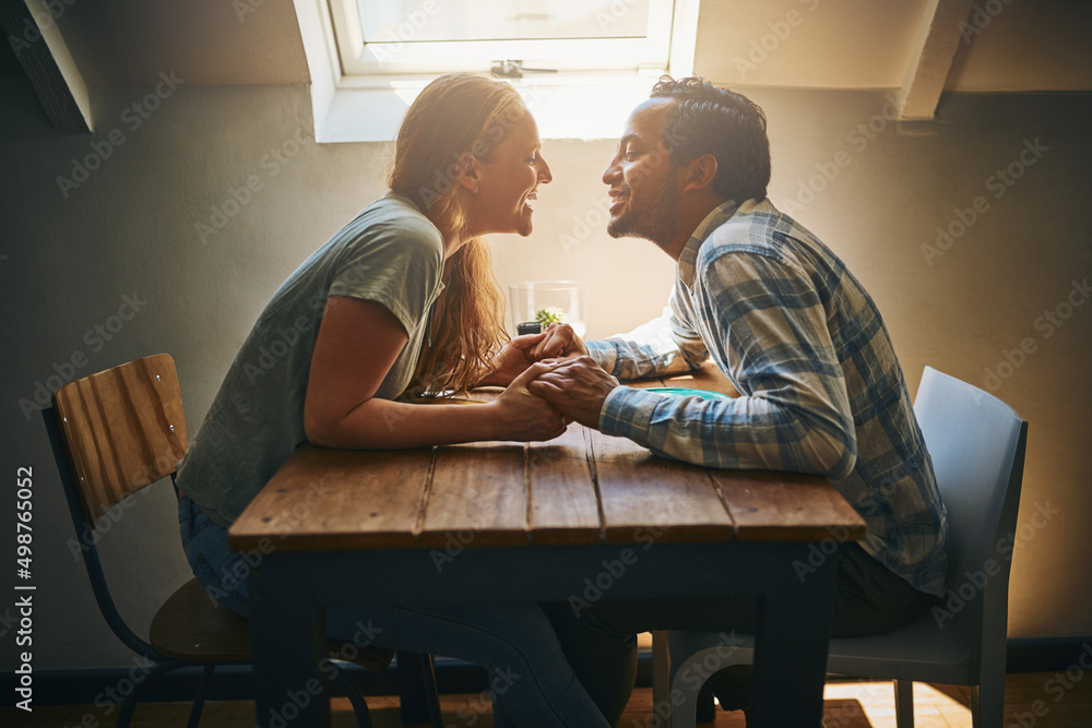 Can I borrow a kiss promise Ill give it back. Shot of a young couple spending time together at a caf