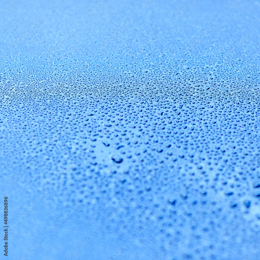 Aqua abstractions. Shot of drops of water on a smooth surface.