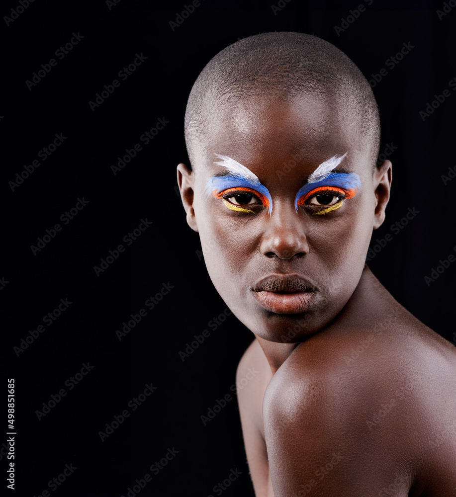 A wild and colorful spirit. Studio portrait of a beautiful model posing with colorful eye makeup on 