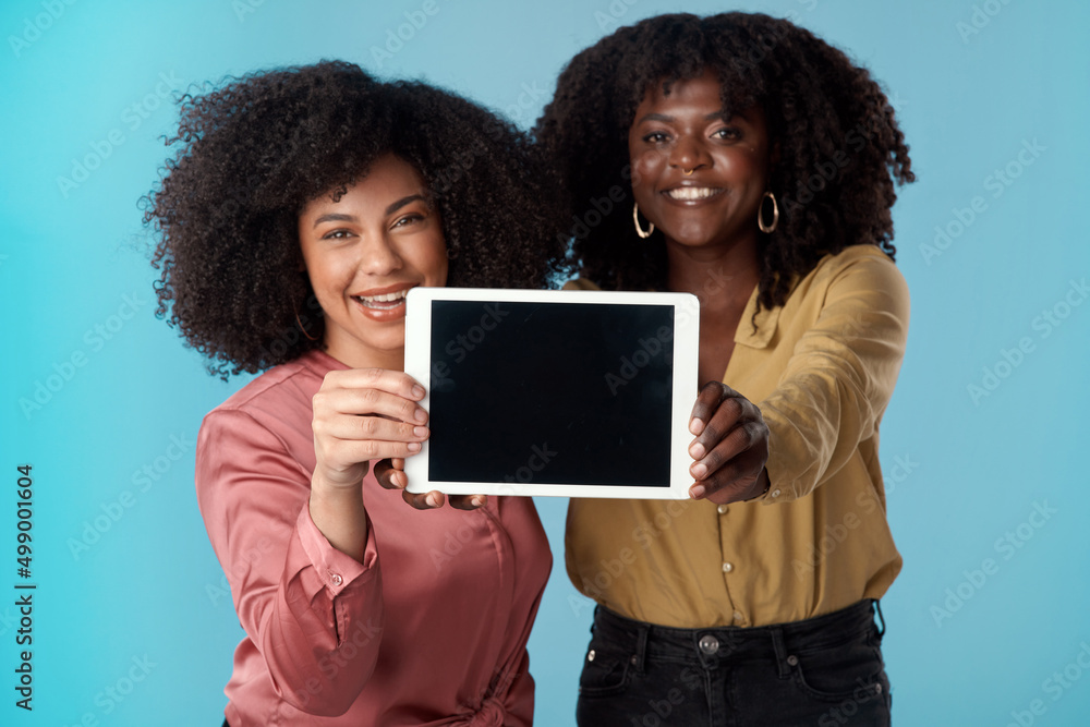 Fire up the wifi, youre going to want to download this. Studio shot of two young women holding a dig