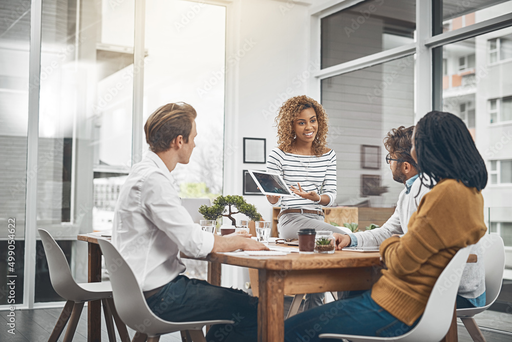 Its time to flex your problem-solving muscles. Shot of a group of businesspeople having a meeting in