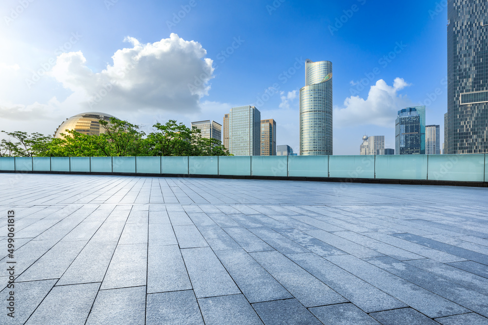 Empty square floor and city skyline with modern commercial buildings in Hangzhou, China.