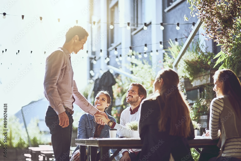 We look forward to working with you. Shot of colleagues shaking hands during a meeting at an outdoor