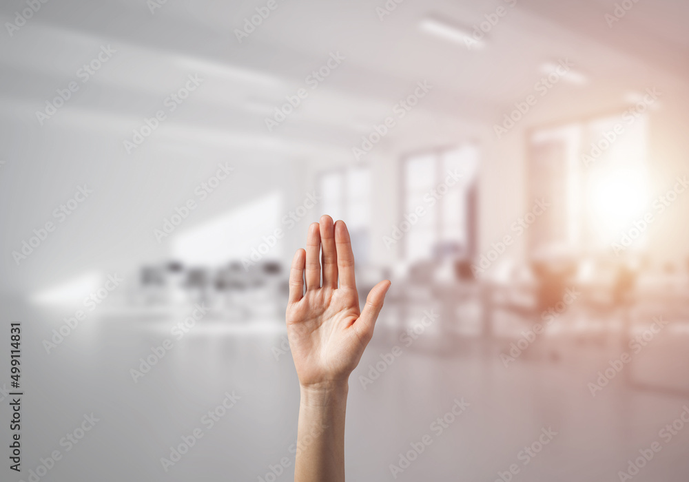 Choosing gesture of person in elegant modern interior in sunshine light