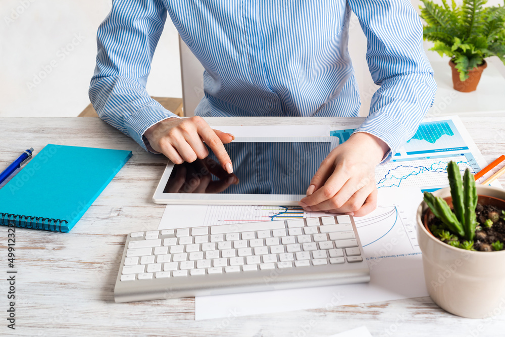 Manager using tablet computer with blank screen