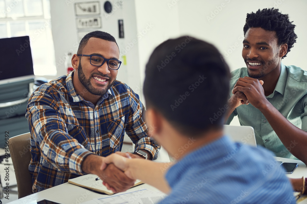 I look forward to seeing the fresh perspective youll bring. Cropped shot of designers shaking hands 