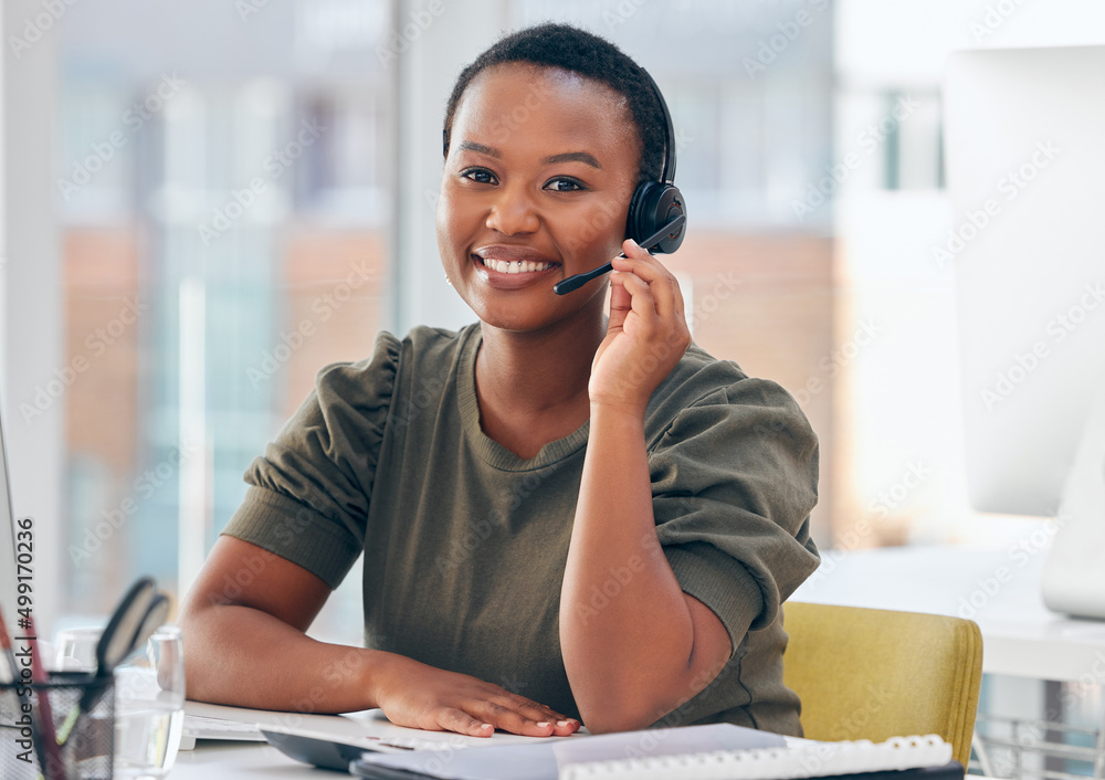 Wed love to hear from you. Shot of a woman wearing a headset while working in a call centre.