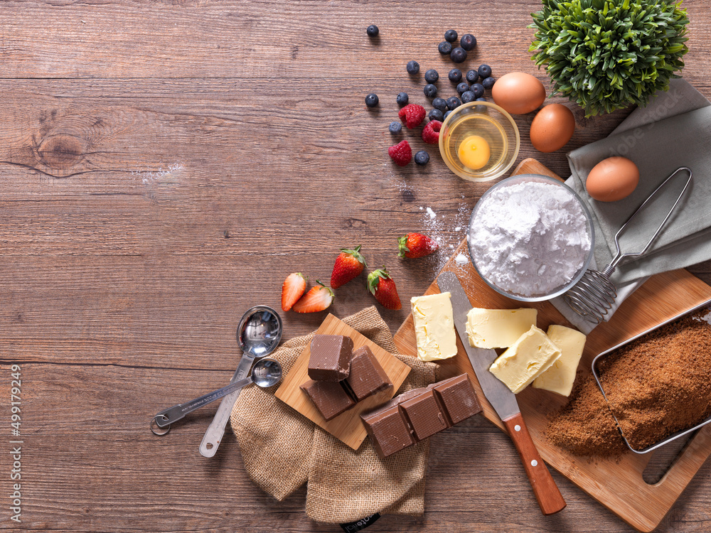 Chocolate, egg,  leaf, restaurant background with wooden tray, top view powder splash wooden backgro