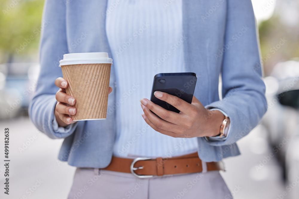 On the go and ready. Cropped shot of an unrecognizable businessman using his cellphone outside.