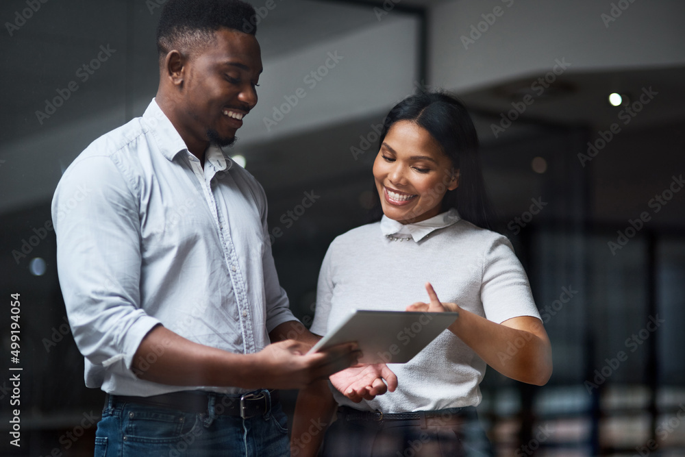 Dont wish it were easier. Wish you were better. Shot of Two businesspeople working in a modern offic