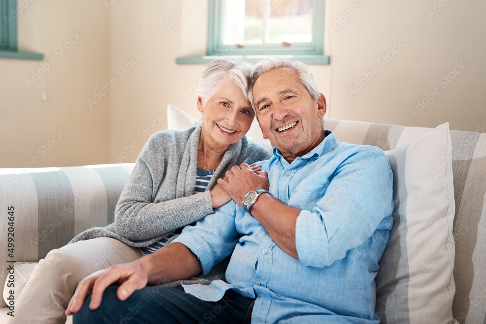 Filling the golden years with lots of love. Shot of a senior couple relaxing together on the sofa at