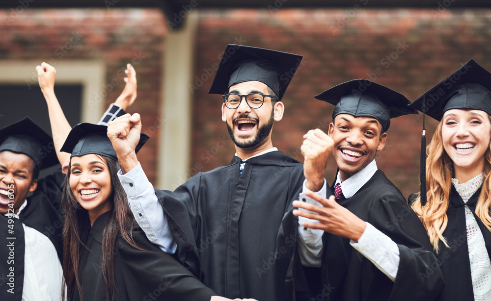 Celebrate every victory in your life. Shot of a group of fellow students standing together on gradua