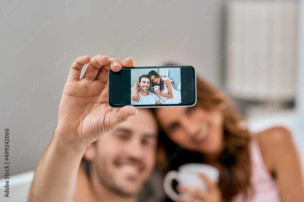 One of the countless memories well share. Shot of a loving young couple taking selfies together at h