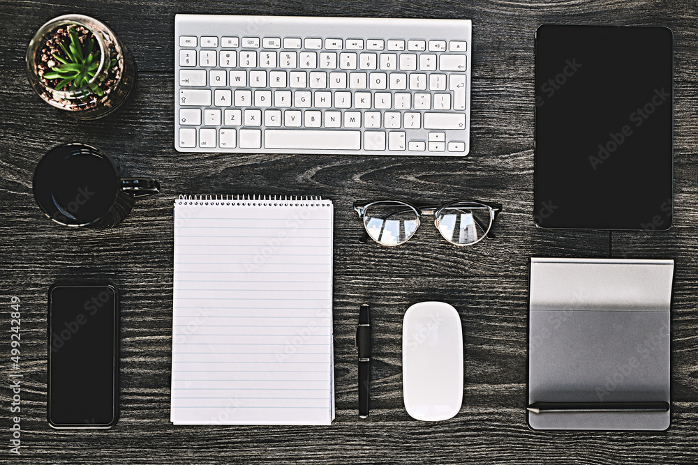 Wireless makes business work. High angle shot of a variety of wireless devices on a work desk.