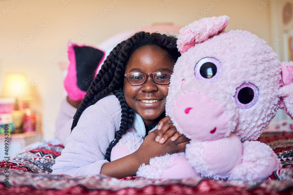 My favourite doll always keeps me company. Portrait of an adorable little girl holding a plush toy w