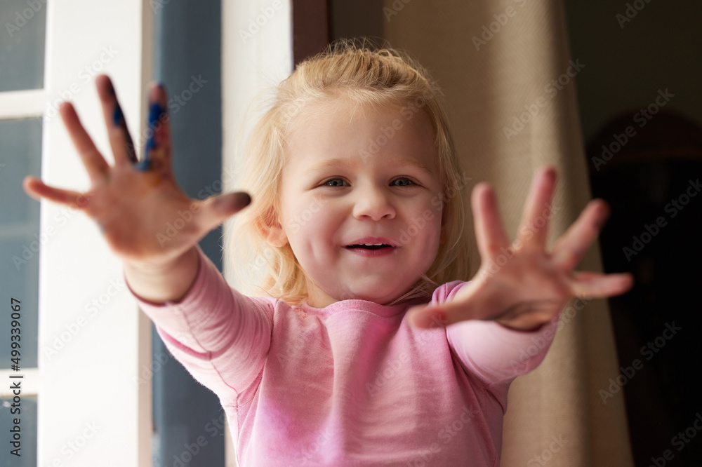 You gotta get messy if you want to have real fun. Shot of an adorable little girl showing off her ha