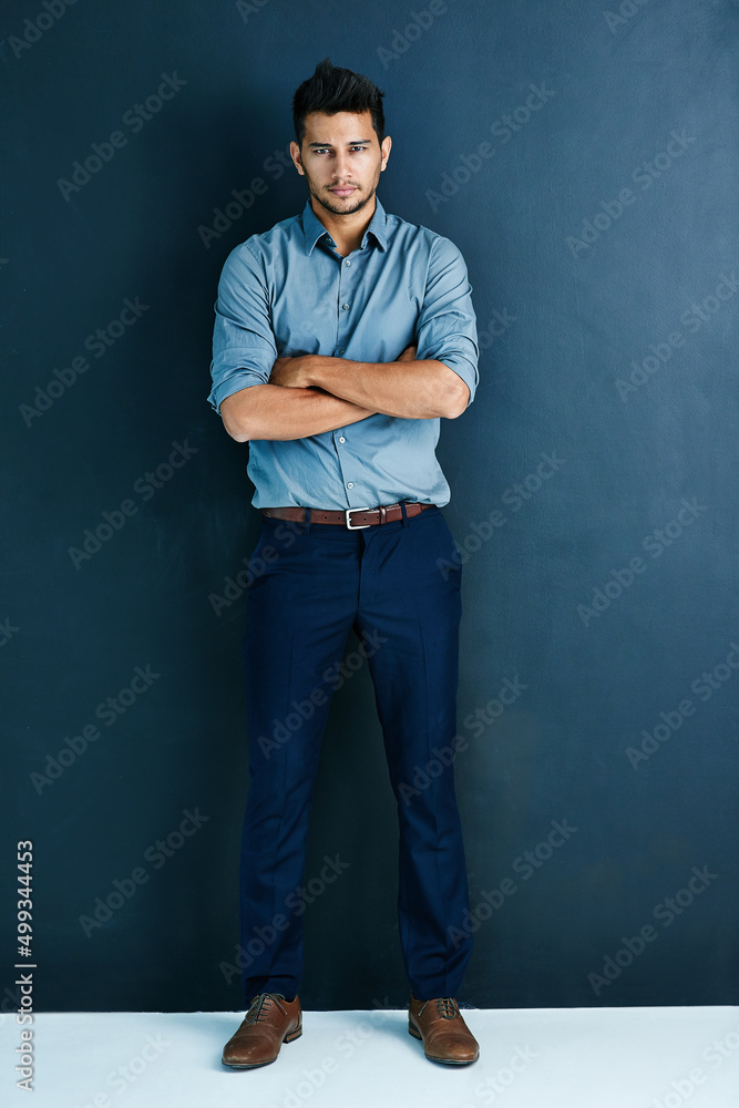 Im not stopping until I reach success street. Studio portrait of a handsome young businessman standi