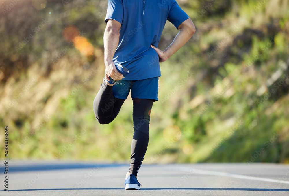 Getting ready to crush some goals. Cropped shot of an unrecognisable man standing alone and stretchi