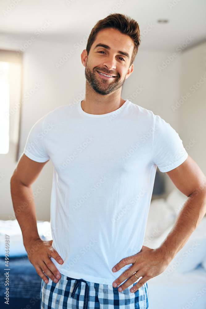 Feeling fresh. Cropped portrait of a handsome young man standing with his hands on his hips in his b