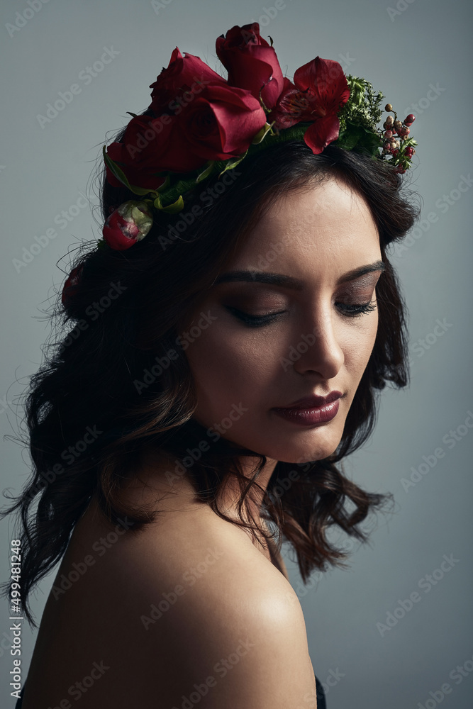 Beauty that Aphrodite would be proud of. Studio shot of a beautiful young woman wearing a floral hea