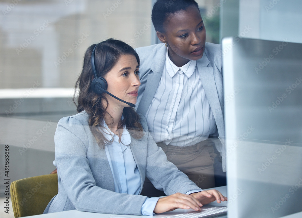 Training her in the art of customer support. Cropped shot of an attractive young female call center 