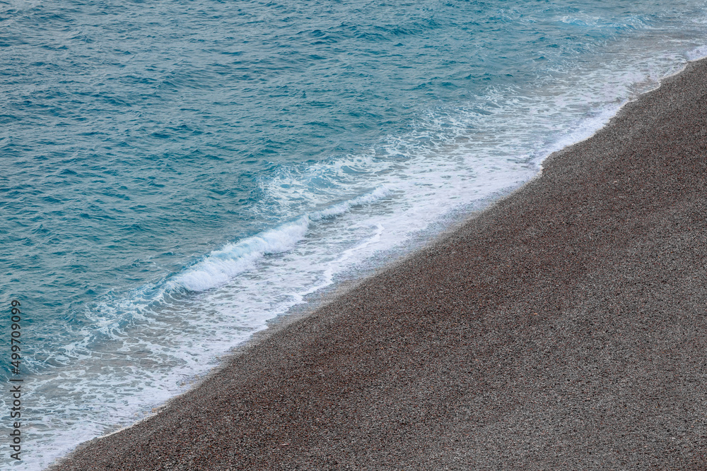 Waves hitting the shore at Antalya Konyaaltı beach