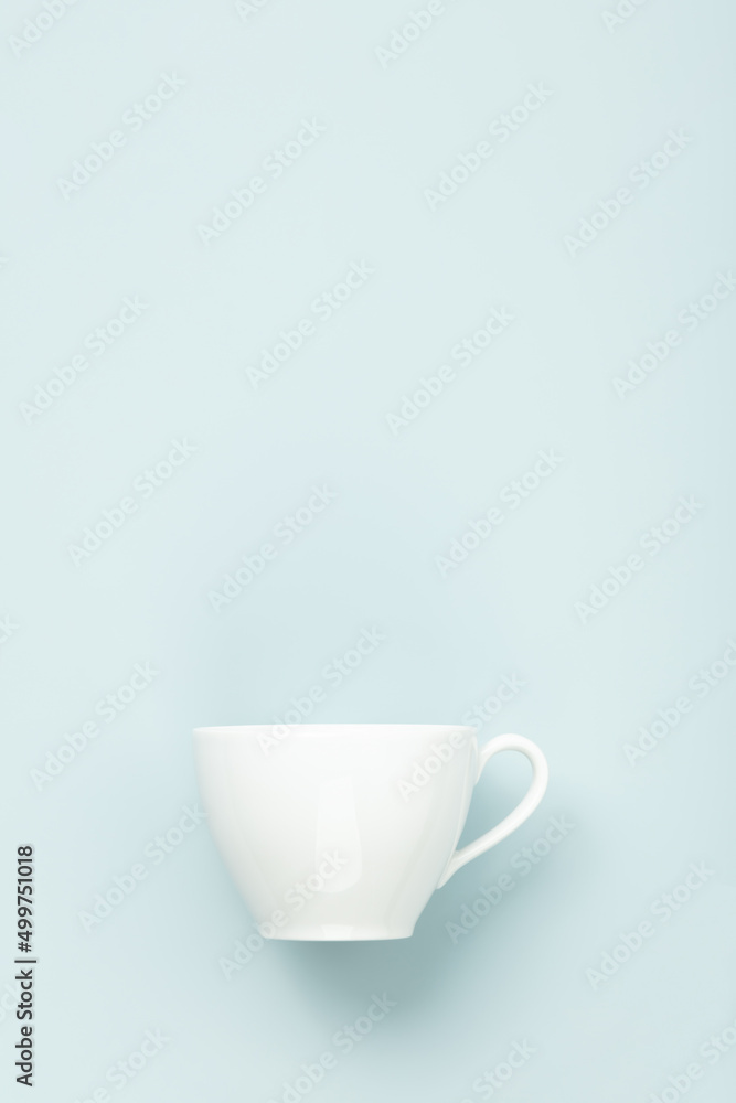 Blank White cup on blue background, flat lay, mock up, copy space