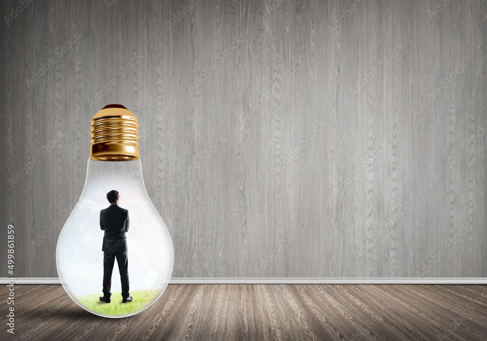 Businessman trapped in bulb