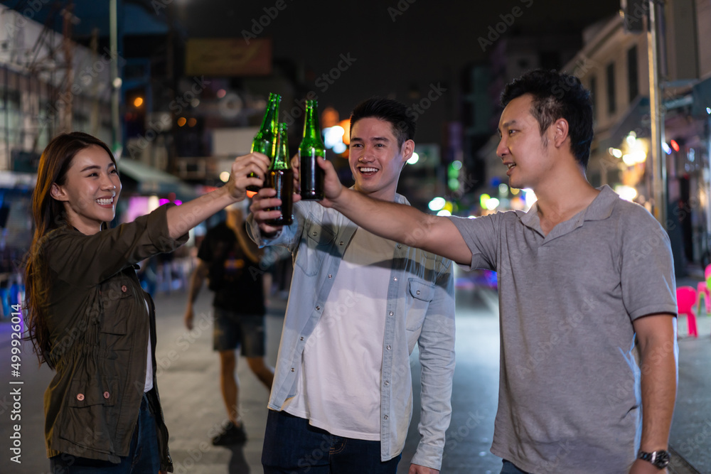 Asian attractive people drinking alcohol with friends and having party