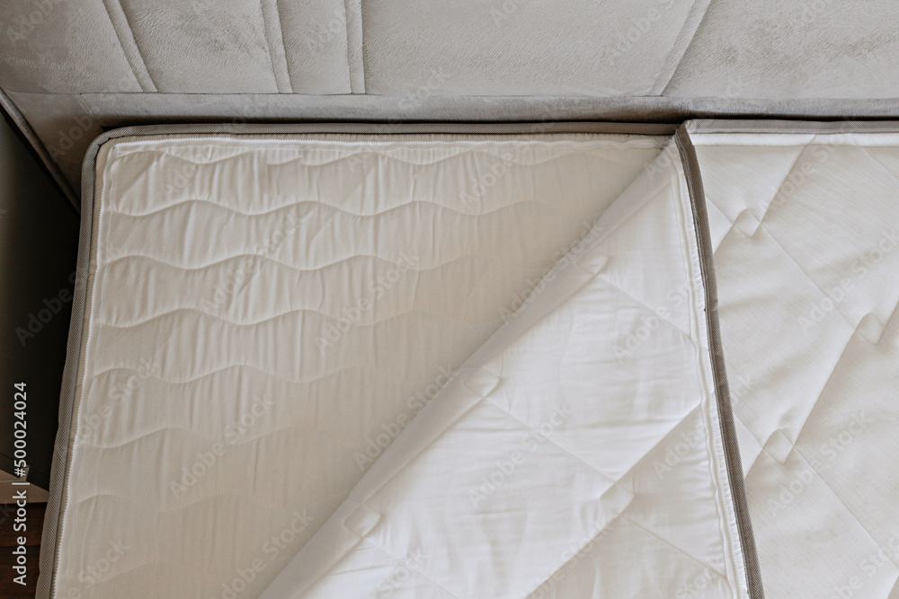 Close up shot of white orthopedic mattress top side surface pattern with a lot of copy space for tex