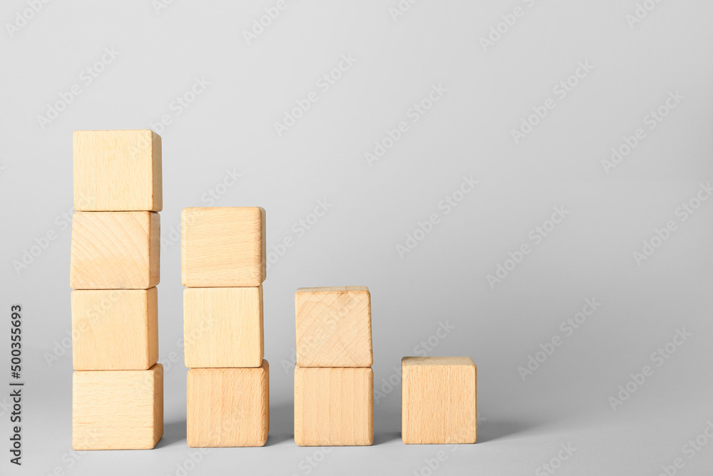 Wooden cubes on light background