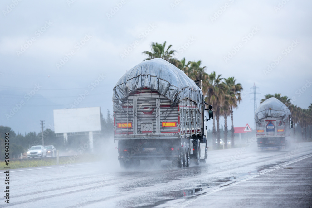 Cars driving along a wet highway in rainy weather in Turkey