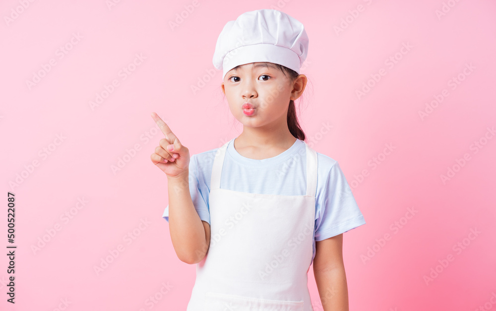 Image of Asian child practicing to be a chef