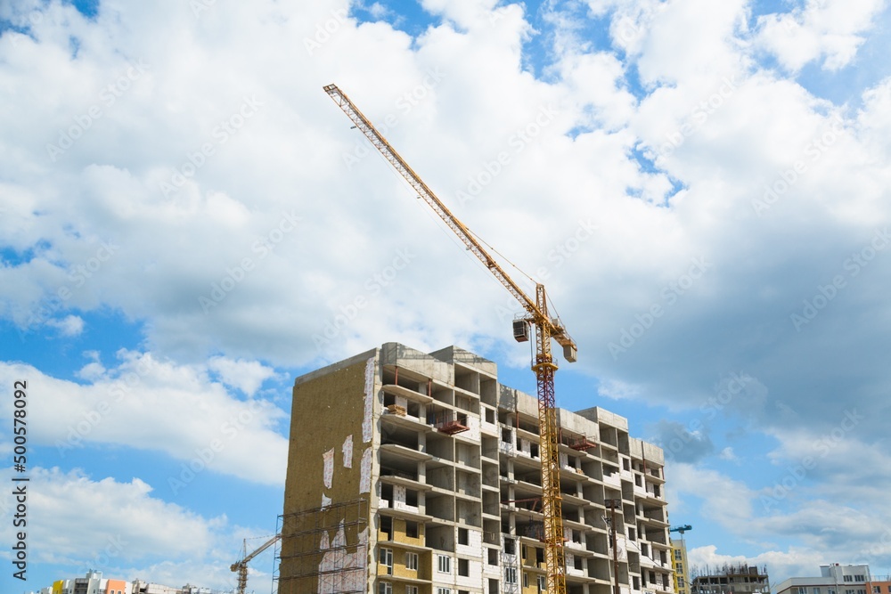 The architectural complex of residential buildings on sky background