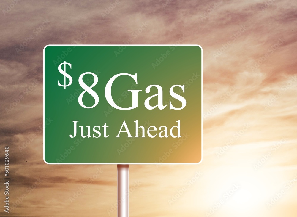 $8 Gas Green letter on Road Sign Against Cloudy Sky.