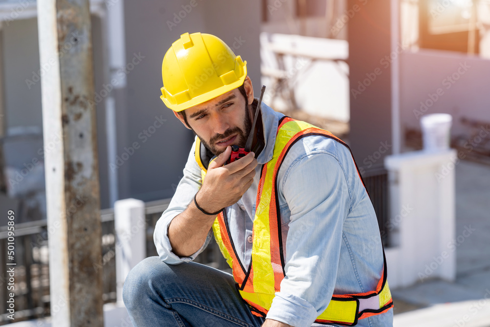 Construction engineering worker talking on radio,Construction engineer use radio communication at co